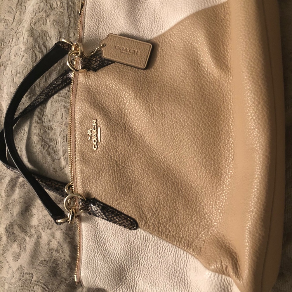 Coach hand bag with gold accents